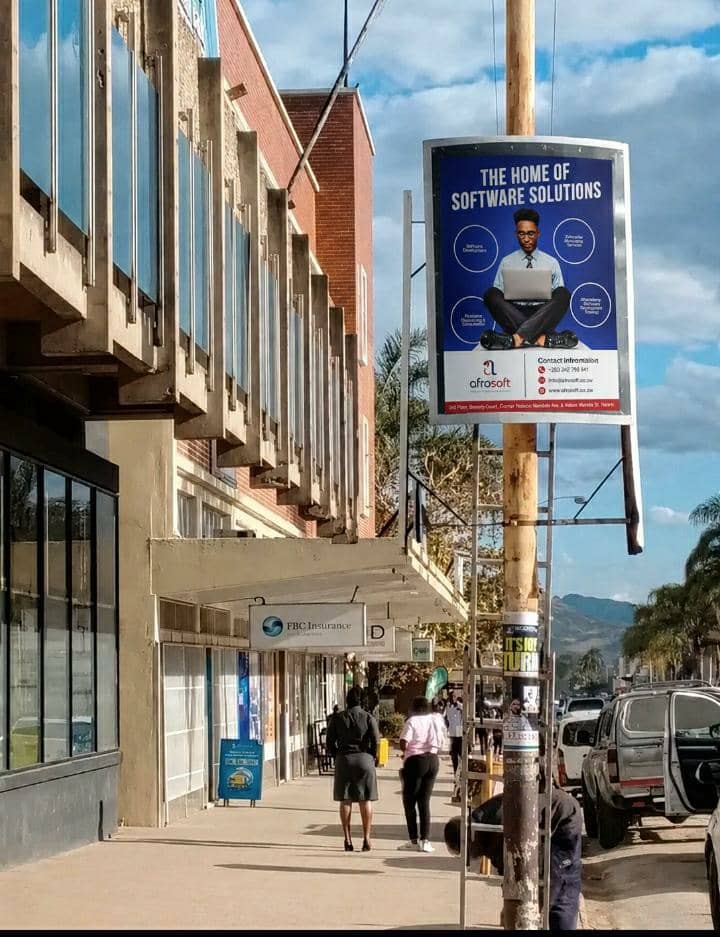 Afrosoft street pole advertising installed in a Zimbabwean CBD by Zariel Advertising